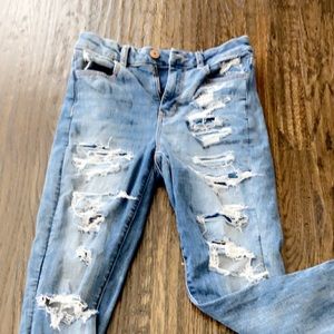 Stretchy ripped denim jeans.